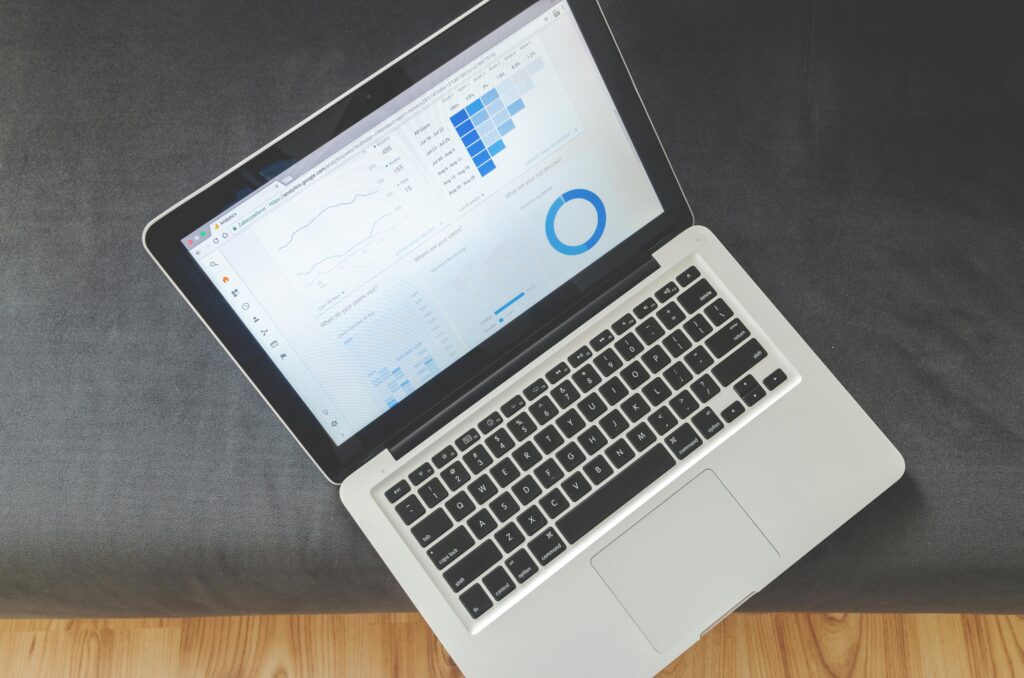 Open laptop displaying website analytics dashboard with graphs and charts, representing SEO performance tracking for small businesses.