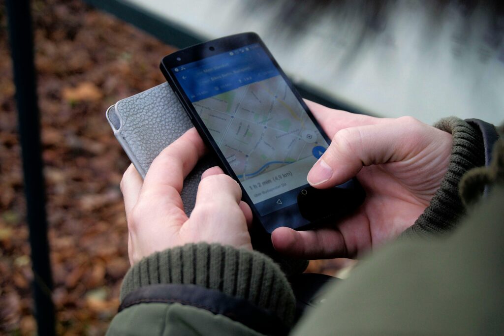 Person using a smartphone to navigate on Google Maps, symbolizing local searches and location-based SEO.